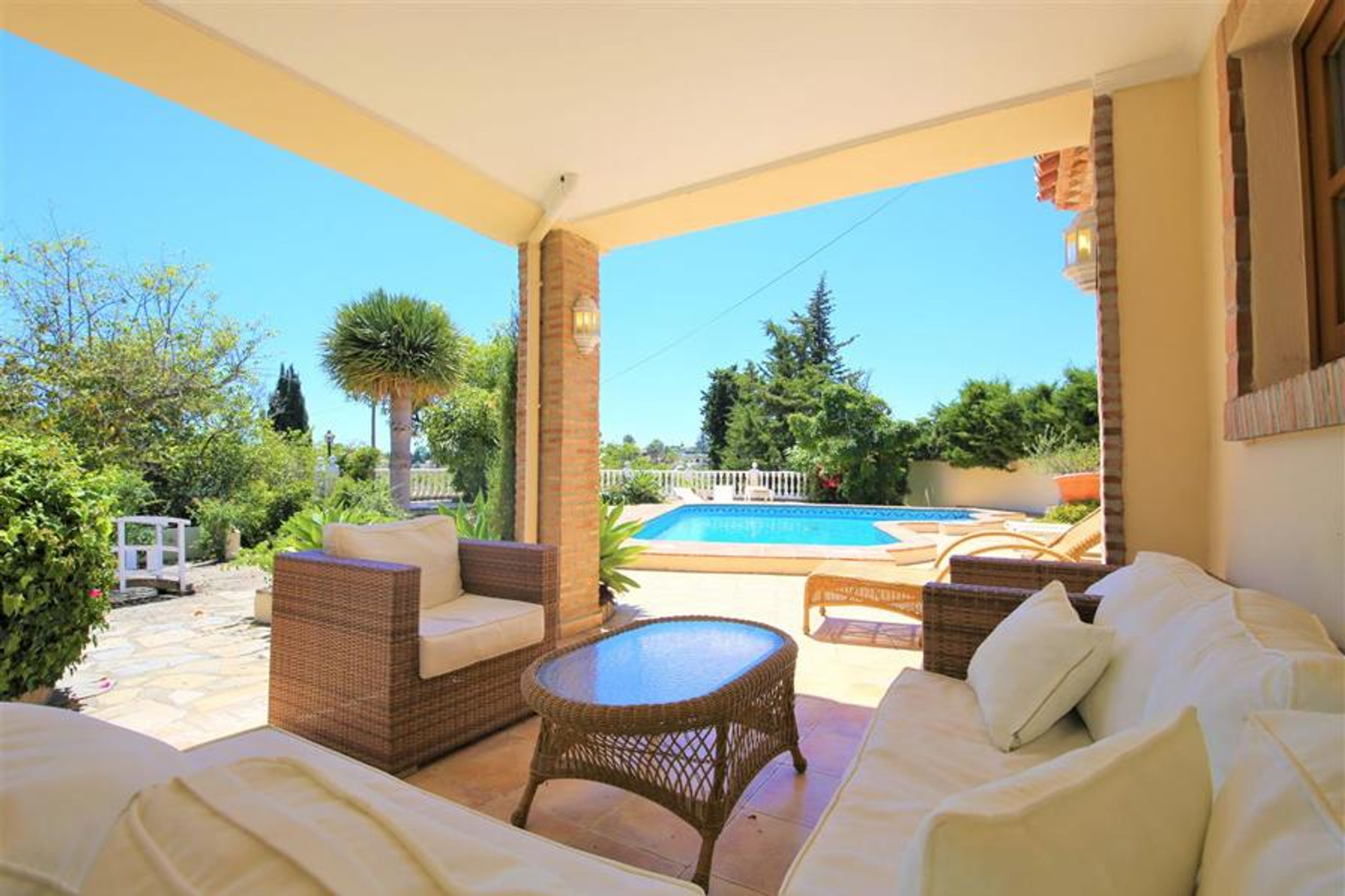Relaxed shady terrace area by the pool