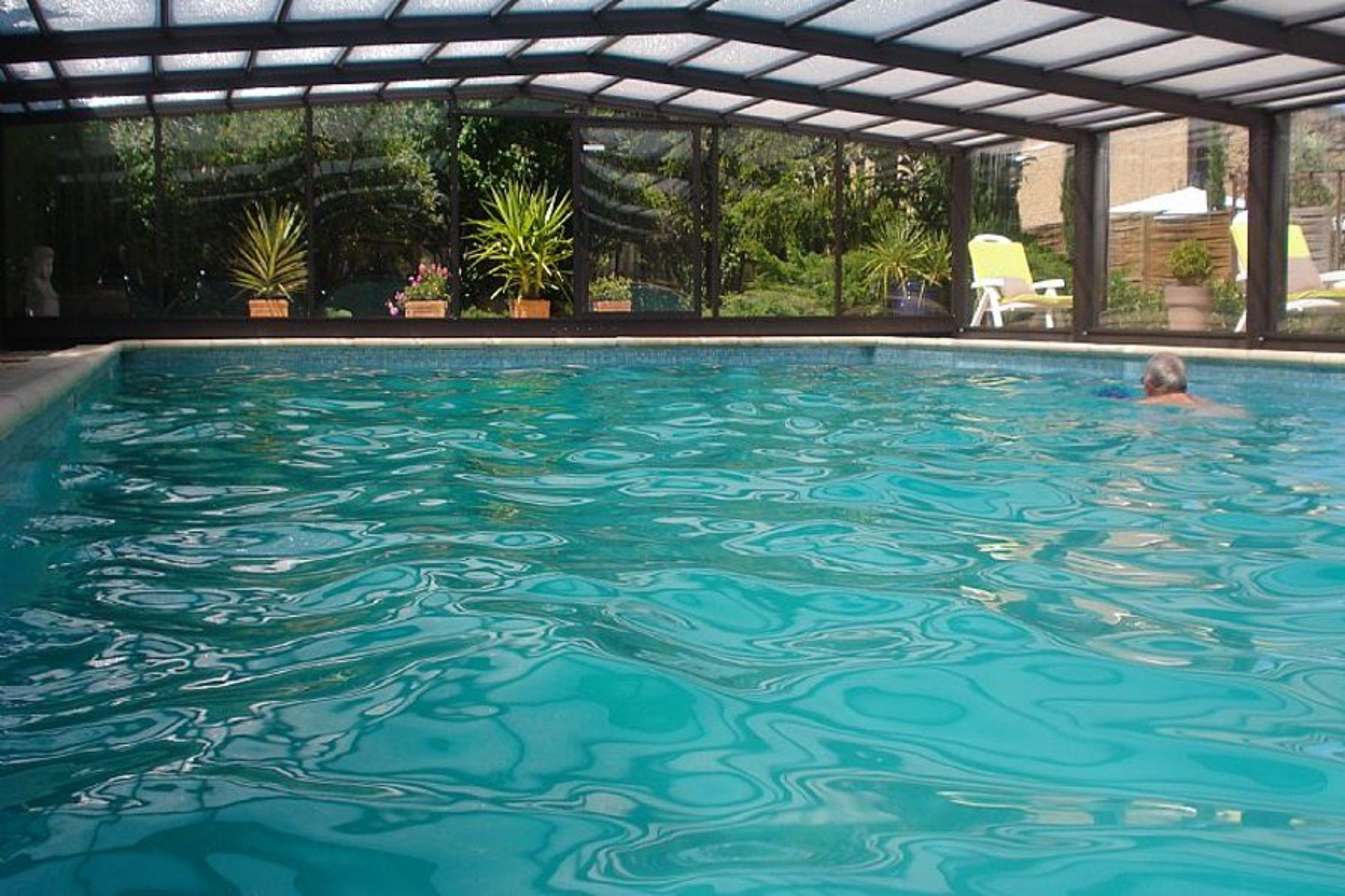 the shelter motorized roof on the pool