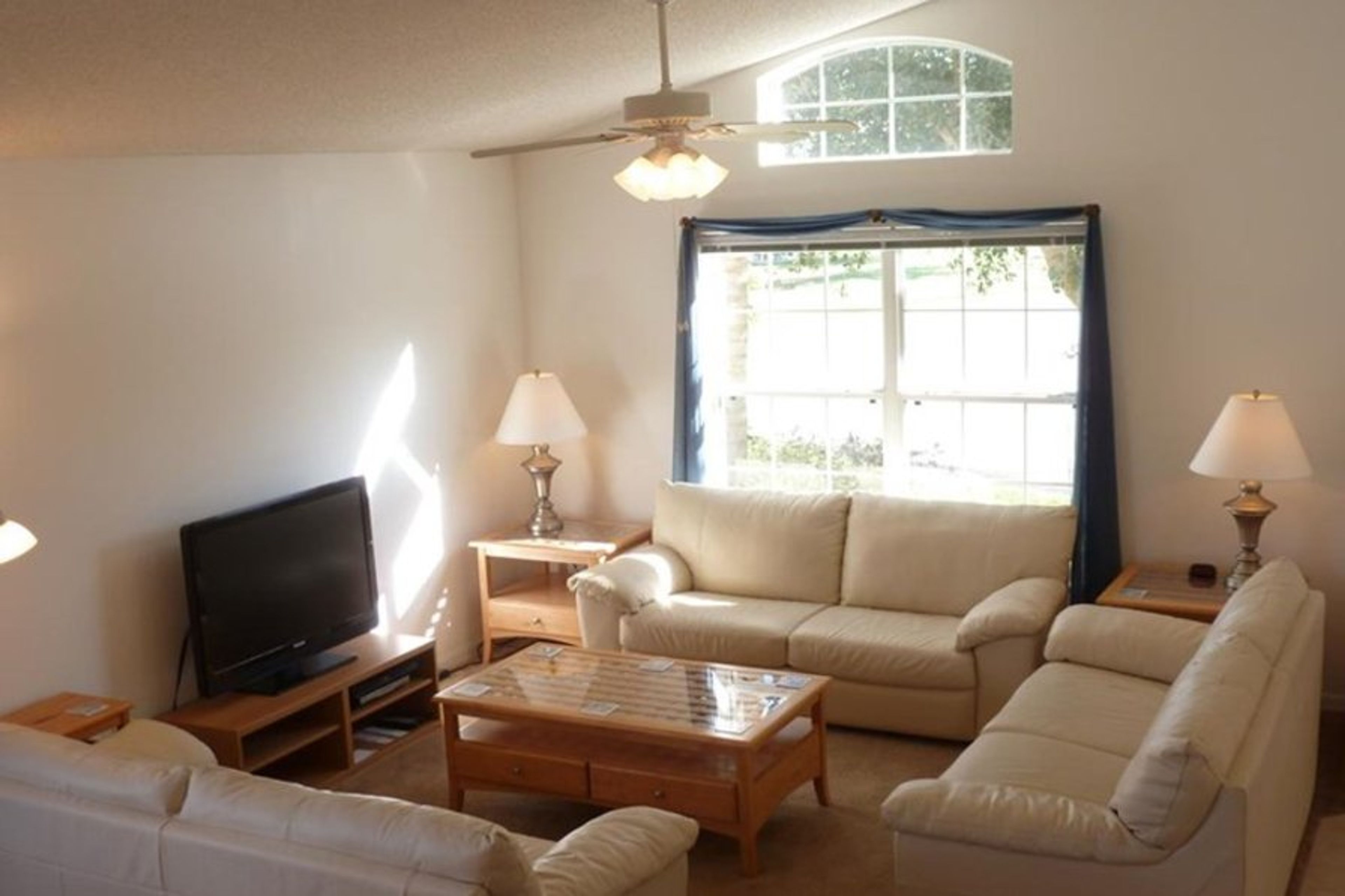 Spacious lounge with 65-inch TV, DVD and DVD library