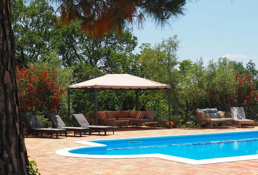 Apartment in Italy, Belpasso: Lovely pool area with ample seating 