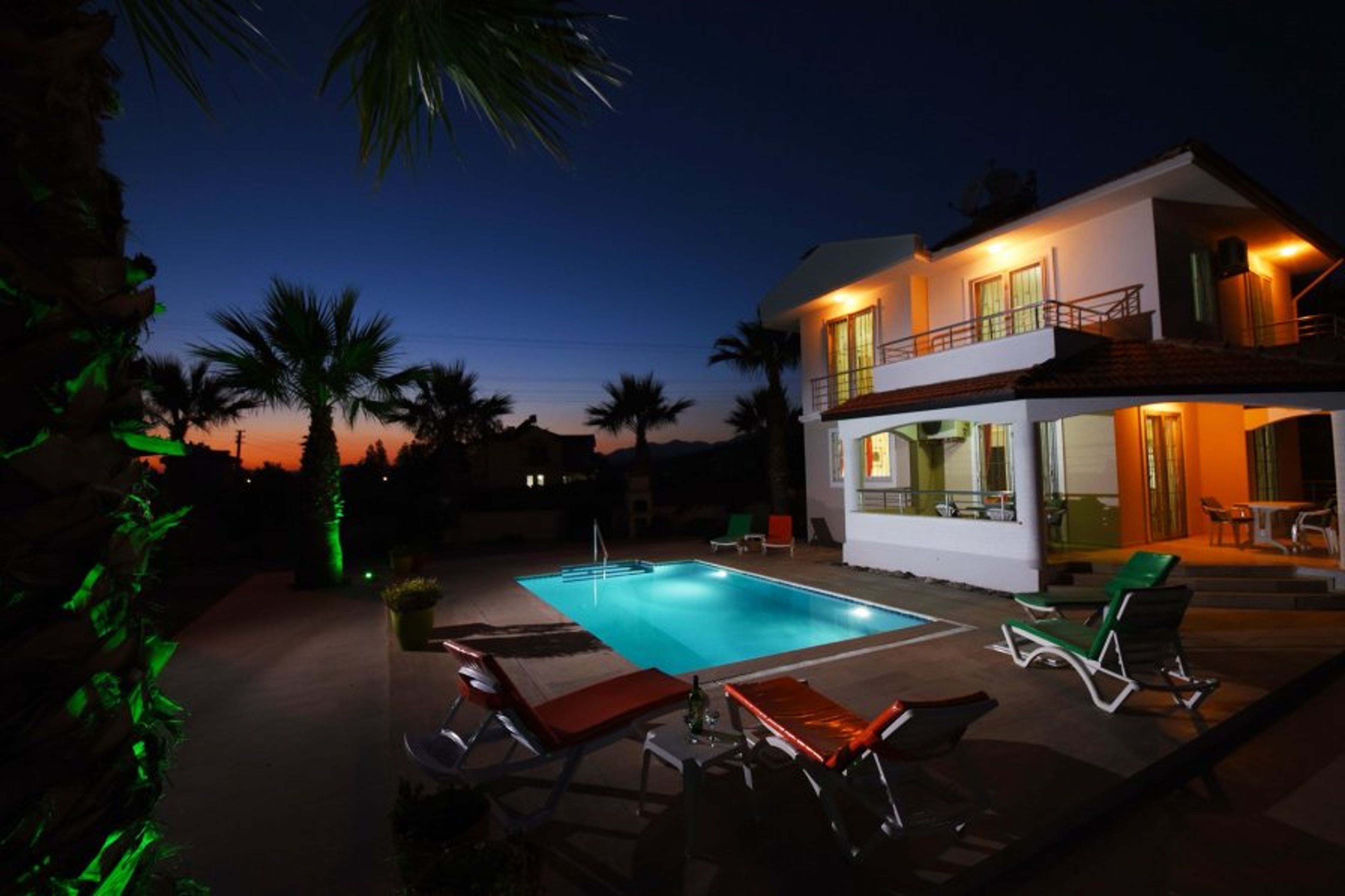 Villa and garden at night