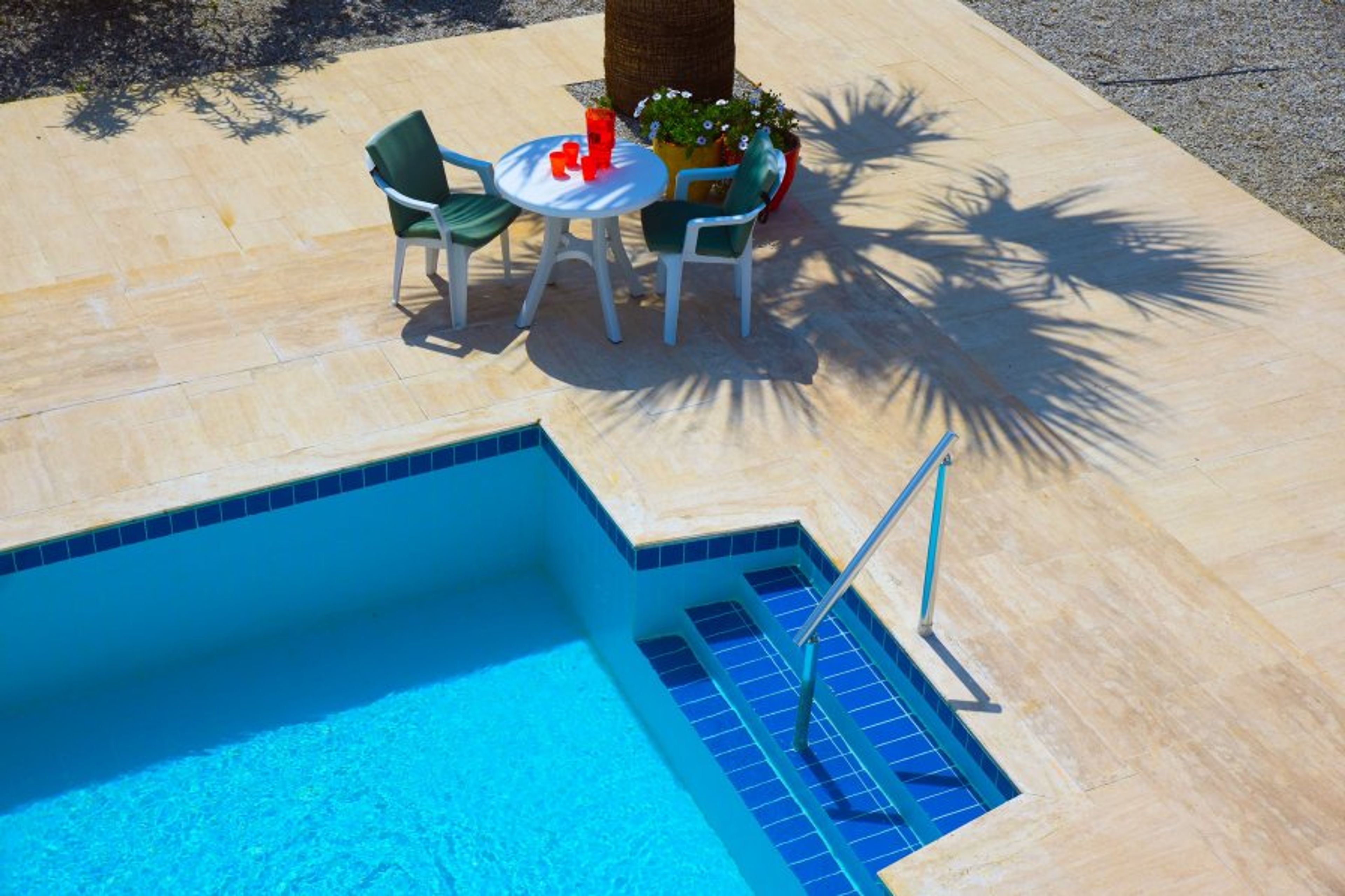 Private pool with spacious sun terrace and seating area