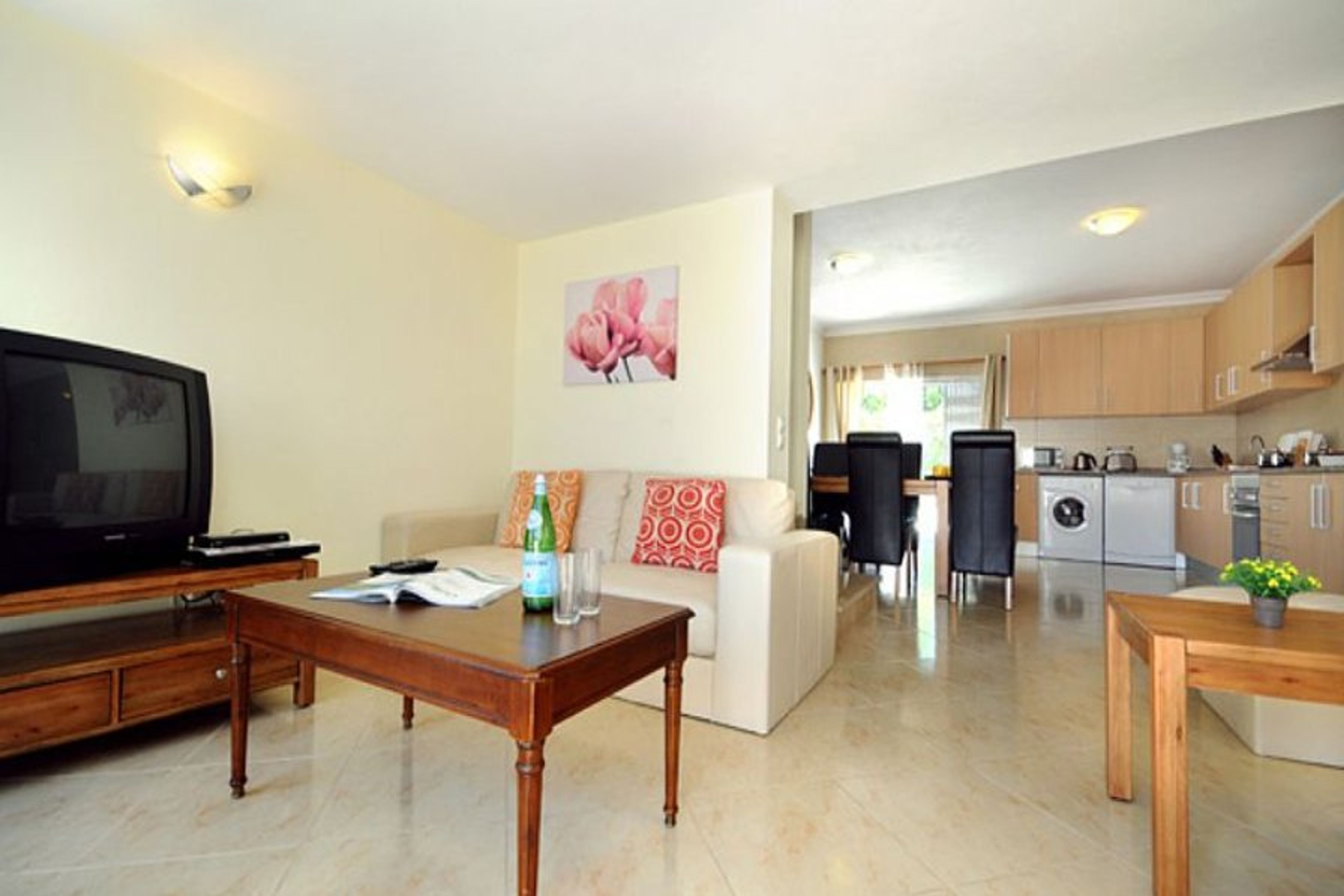 open plan kitchen and living area leading out to the pool