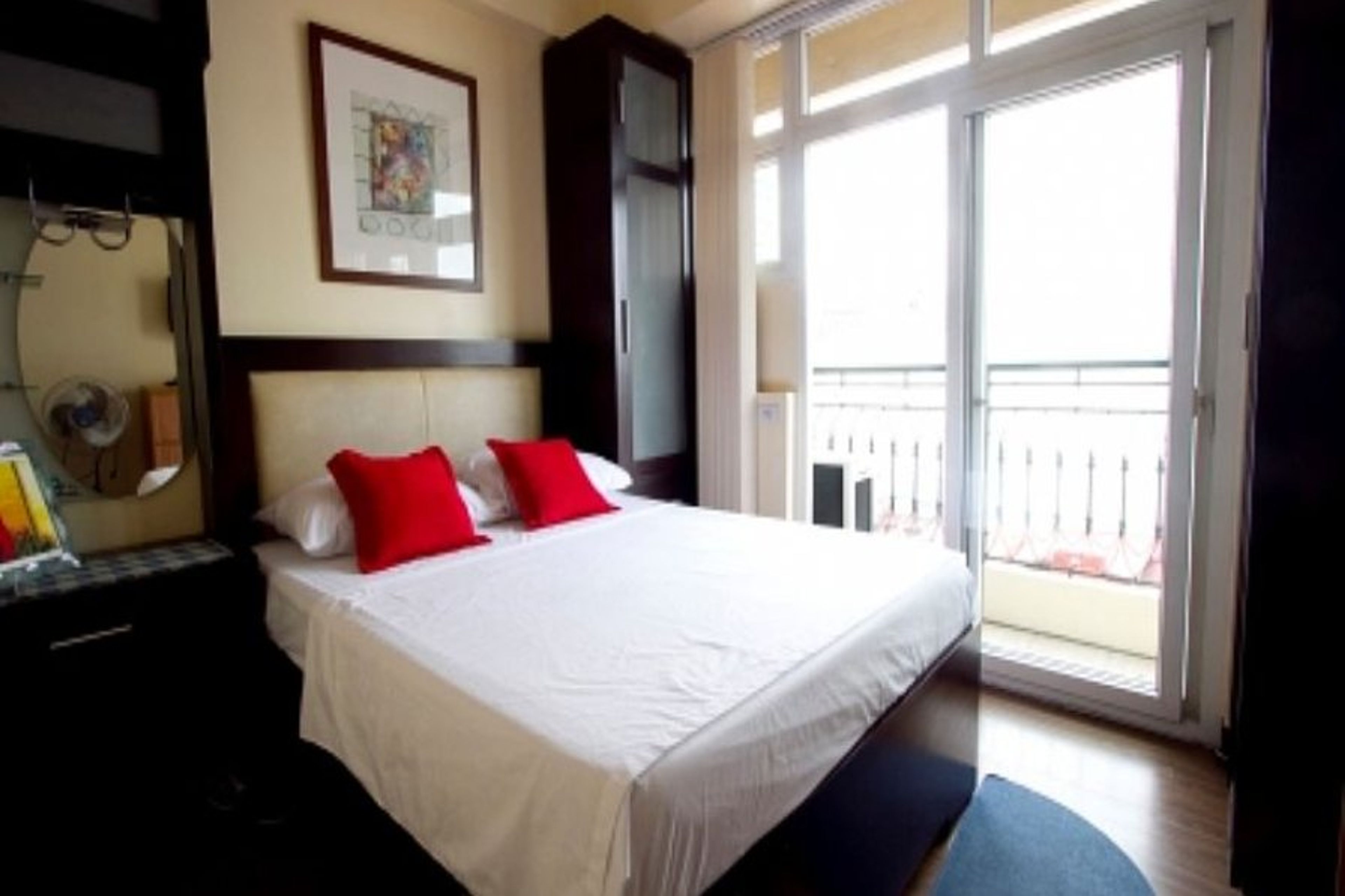 Floor to ceiling sliding doors leading to balcony