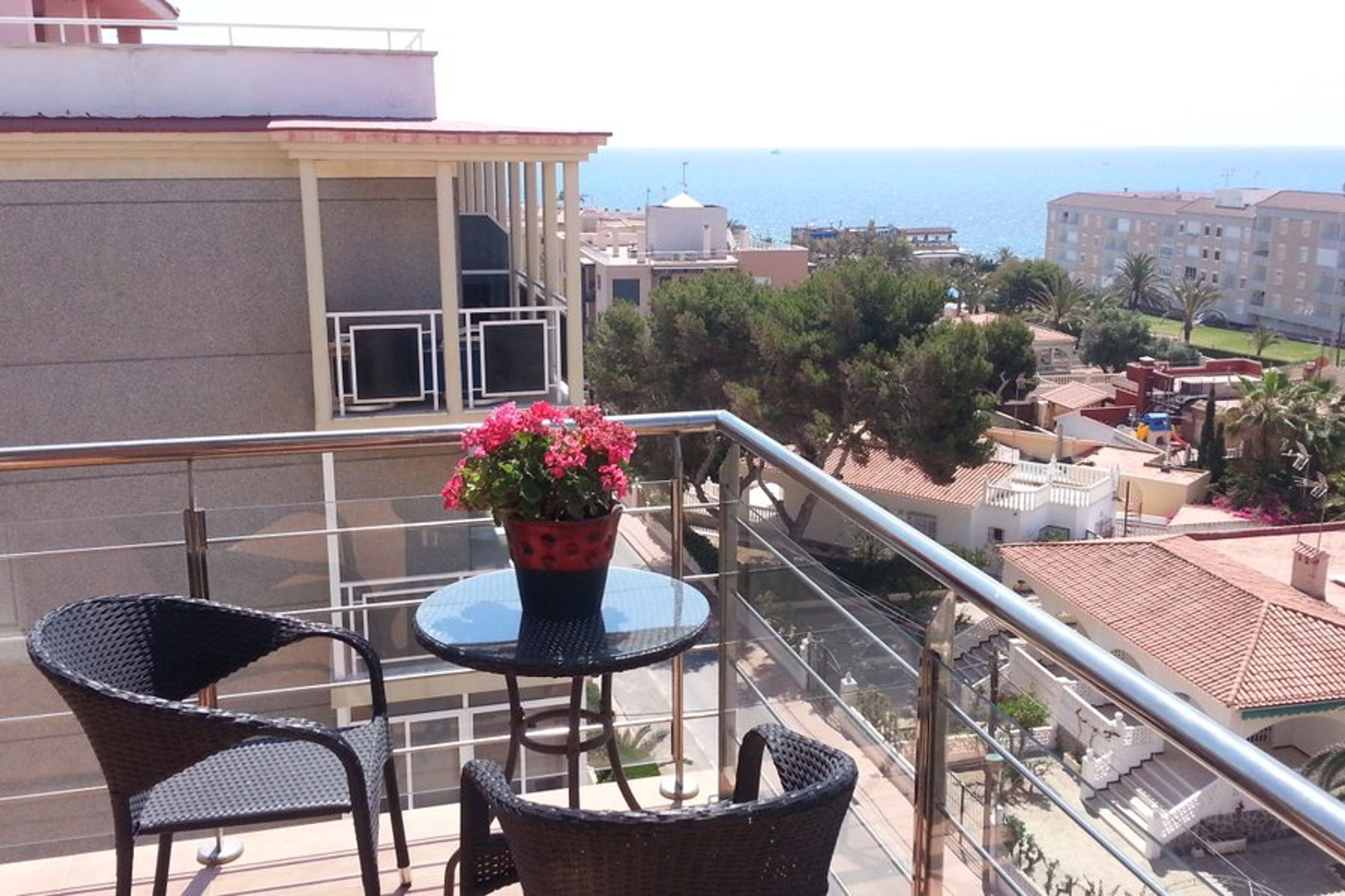 Large wraparound balcony with sea views.