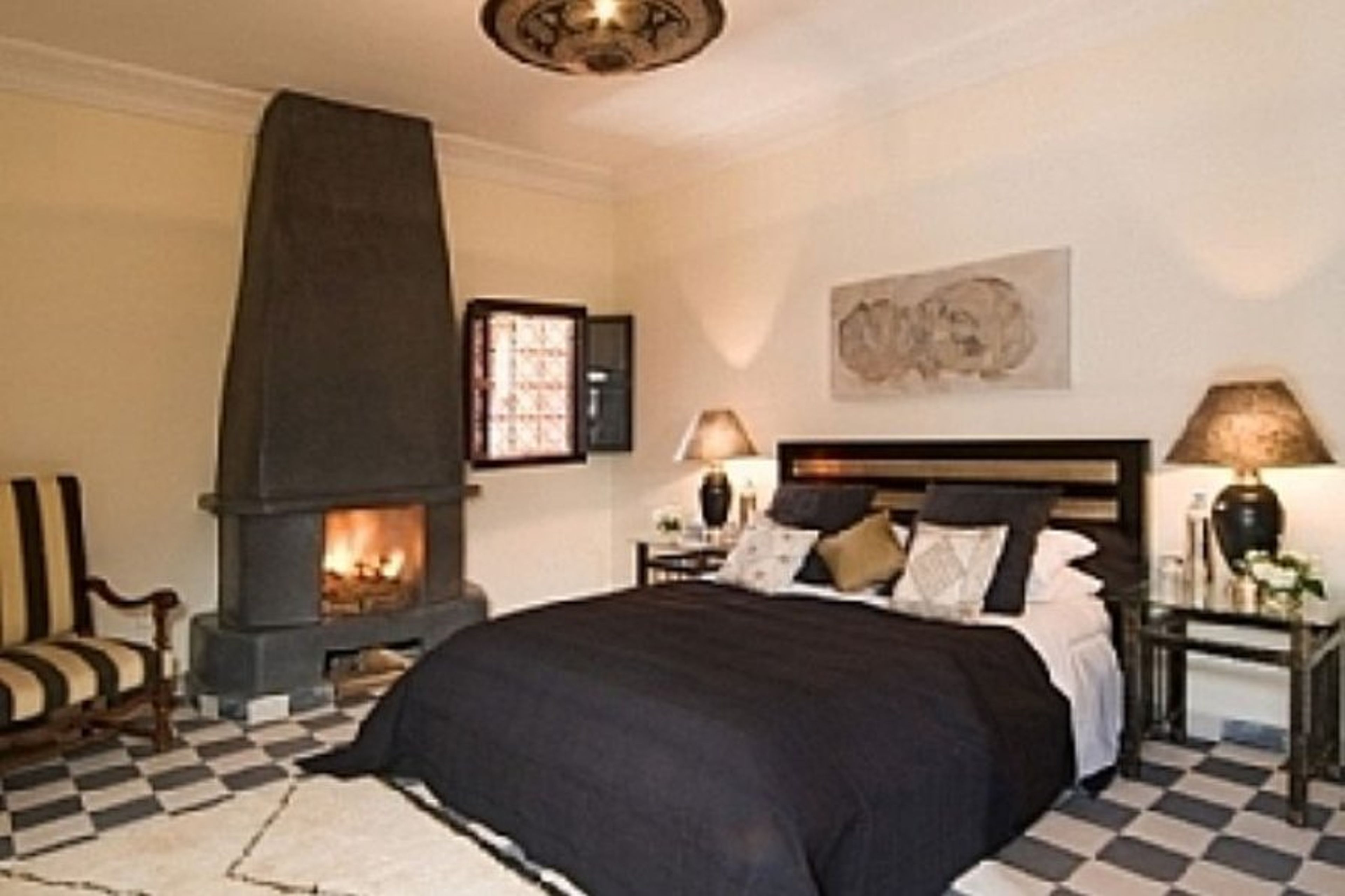 Bedroom with open fire place