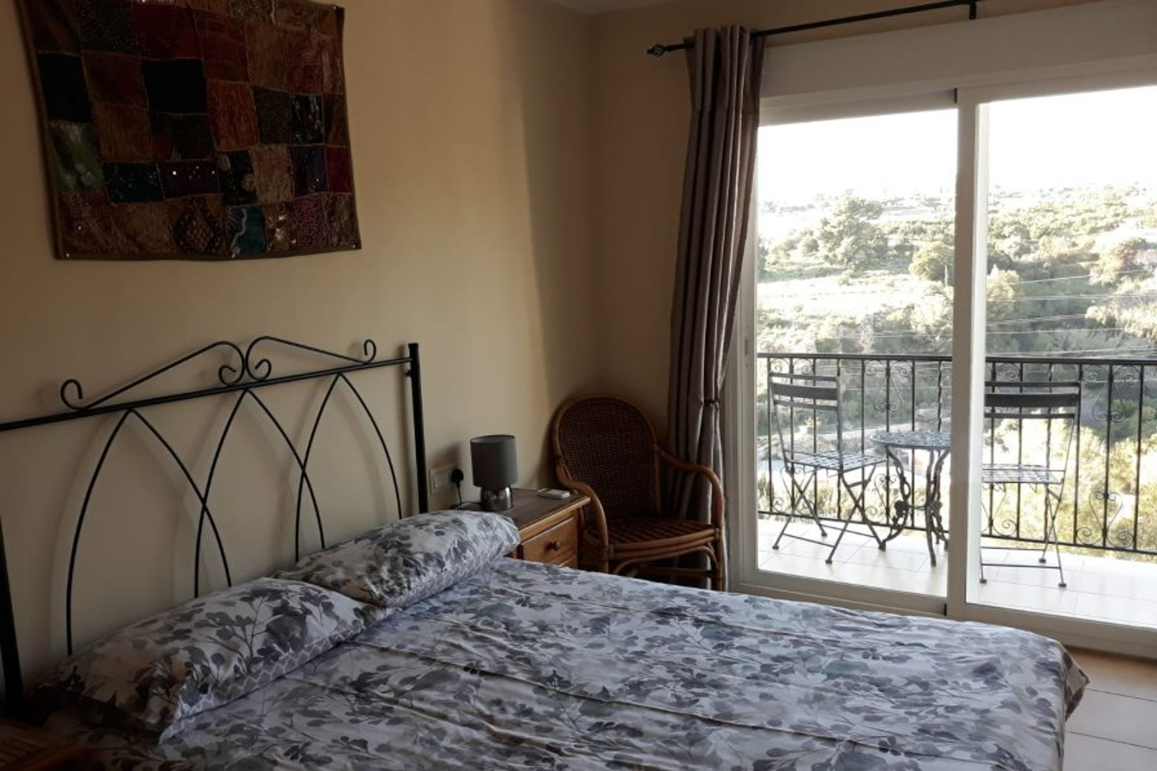 Double air con bedroom with Juliet balcony with great views.