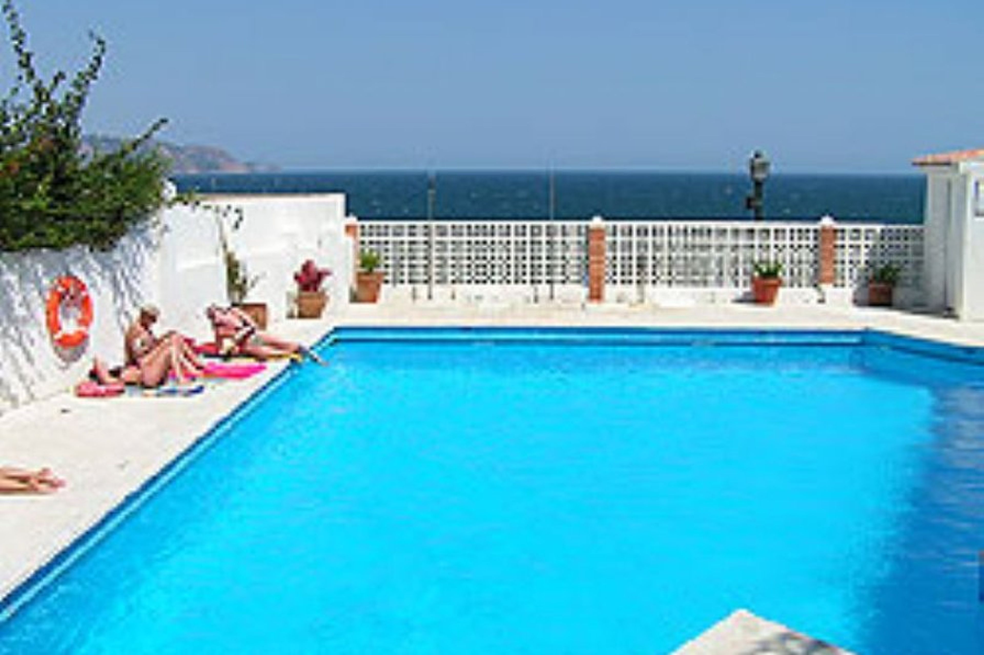 Swimming pool with beach below.